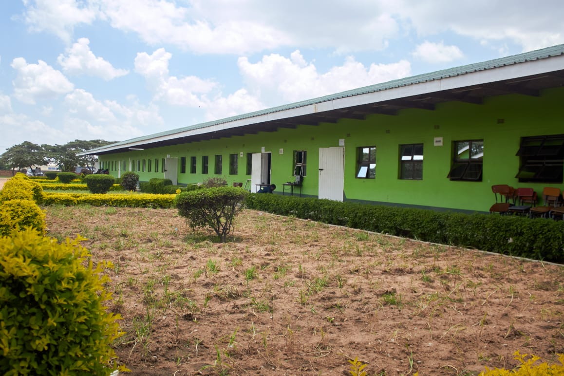 Classroom block and gardens under a blue sky